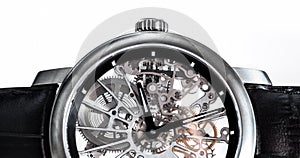 Elegant watch with visible mechanism, clockwork close-up.
