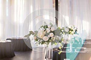 Elegant wedding bouquet with beautiful white roses on the table