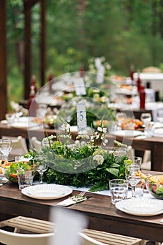 Elegant wedding table arrangement, floral decoration, restaurant. Wedding table setup.