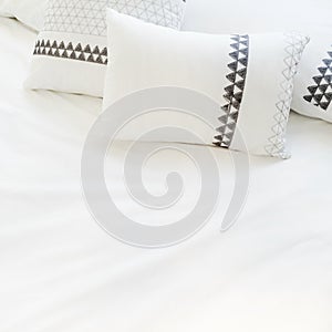 Elegant white bed linen with pillows