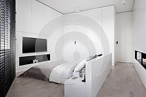 Elegant white bedroom with tv