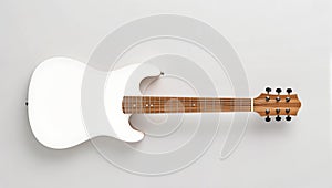 Elegant white guitar on a neutral background in bright studio