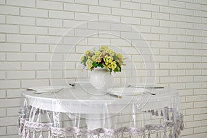 Elegant white round dining table in modern kitchen interior