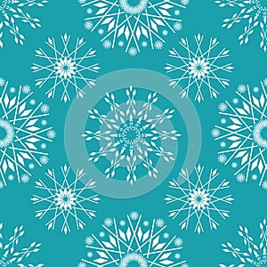 Elegant white snow crystals in timeless winter design. Seamless vector pattern on ice blue background. Great for winter