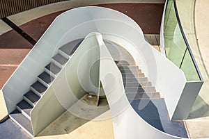 Elegant white stair case in a dark surrounding