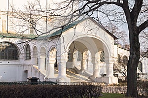 Elegant white stone porch in the sunset light. Fragment of the Smolensky Cathedral in Novodevichy Convent, Moscow.