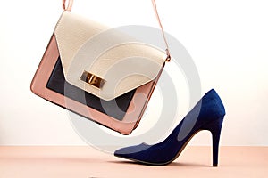 Elegant woman accessories, hand bag and high heel shoes photo