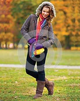 Elegant woman in autumn scenery