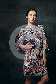 Elegant Woman in Cocktail Dress Holding Purse Ready for Party