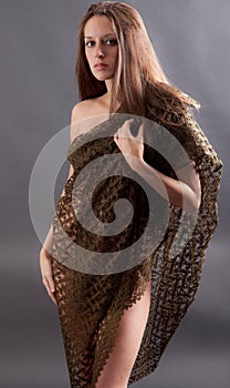 Elegant Woman Covering Self With Netted Wrap