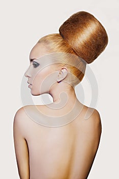 Elegant woman with creative hair style. Fashion