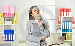 Elegant woman with document folder. thinking office worker. formal fashion style. stylish woman work at workplace. girl