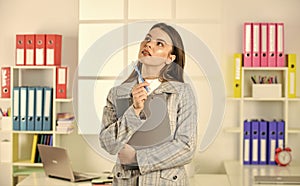 elegant woman with document folder. thinking office worker. formal fashion style. stylish woman work at workplace. girl