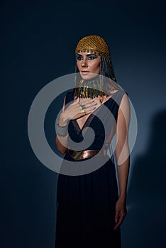 Elegant woman in egyptian headdress and