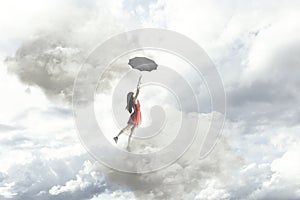 an elegant woman flying in the middle of the clouds hanging on her umbrella