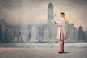 Elegant woman in front of a city landscape