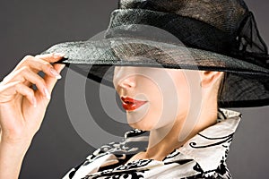 Elegant woman is in a hat