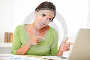 Elegant woman looking cheerfully while working