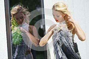 Elegant woman looking at shop window