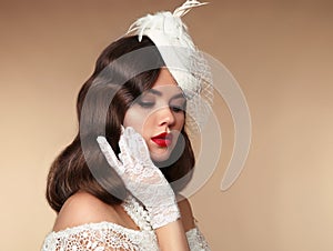 Elegant woman portrait in retro hat. Pin up girl wears in pearls