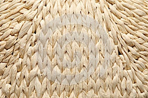 Elegant woman`s straw bag as background, closeup