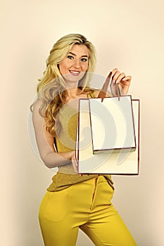 elegant woman shopaholic. girl shopper hold paperbag package. buy presents online. gift shop for any holiday. sell-out