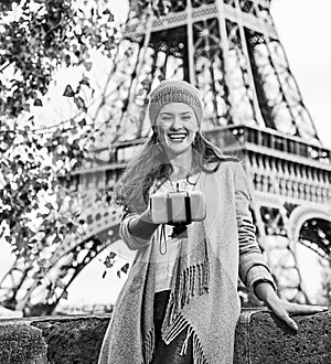 Elegant woman taking selfie using selfie stick in Paris, France