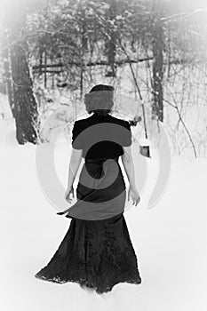 Elegant Woman Walking in Snow