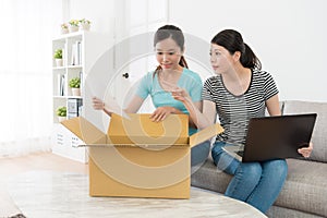 Elegant women buyer opening shipping parcel