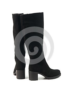 Elegant women`s tall black winter high heeled boots isolated on white background