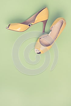 Elegant Yellow Female Leather Shoes on Summer Green Background Flat Lay Top Vew Copy Spac Sales Fashion Concept Vertical