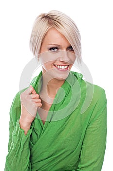 Elegant young blond woman in green