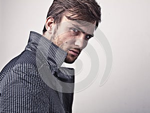 Elegant young handsome man. Studio fashion portrait.