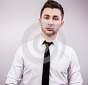 Elegant young handsome man. Studio fashion portrait.