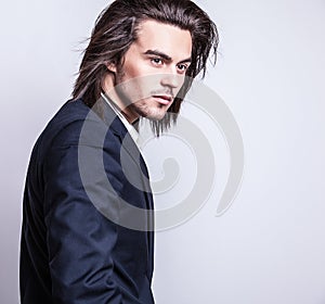 Elegant young handsome man. Studio fashion portrait.