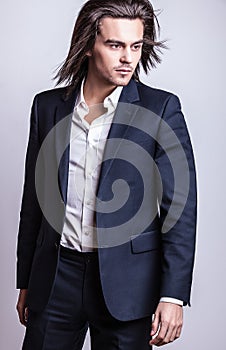 Elegant young handsome man. Studio fashion portrait.