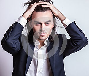 Elegant young handsome man. Studio fashion portrait.