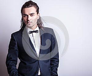 Elegant young handsome man. Studio fashion portrait.