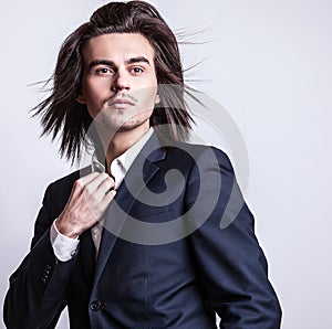 Elegant young handsome man. Studio fashion portrait.