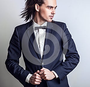 Elegant young handsome man. Studio fashion portrait.