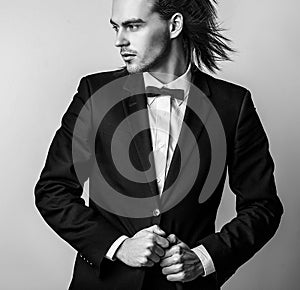 Elegant young handsome man. Studio fashion portrait.