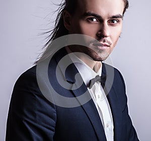 Elegant young handsome man. Studio fashion portrait.