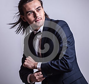 Elegant young handsome man. Studio fashion portrait.