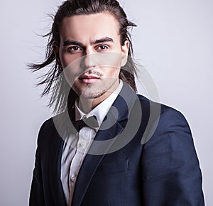 Elegant young handsome man. Studio fashion portrait.