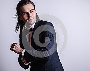 Elegant young handsome man. Studio fashion portrait.