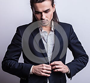 Elegant young handsome man. Studio fashion portrait.