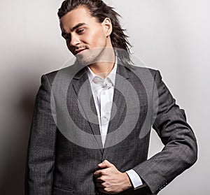 Elegant young handsome man. Studio fashion portrait.