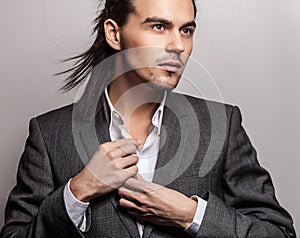 Elegant young handsome man. Studio fashion portrait.