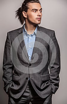 Elegant young handsome man. Studio fashion portrait.