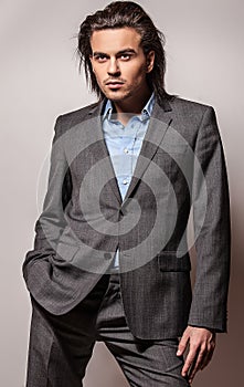 Elegant young handsome man. Studio fashion portrait.